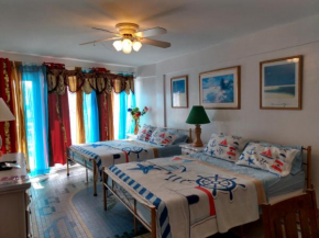 Ocean balmy warm healing breeze under sapphire sky year round on sunny balcony